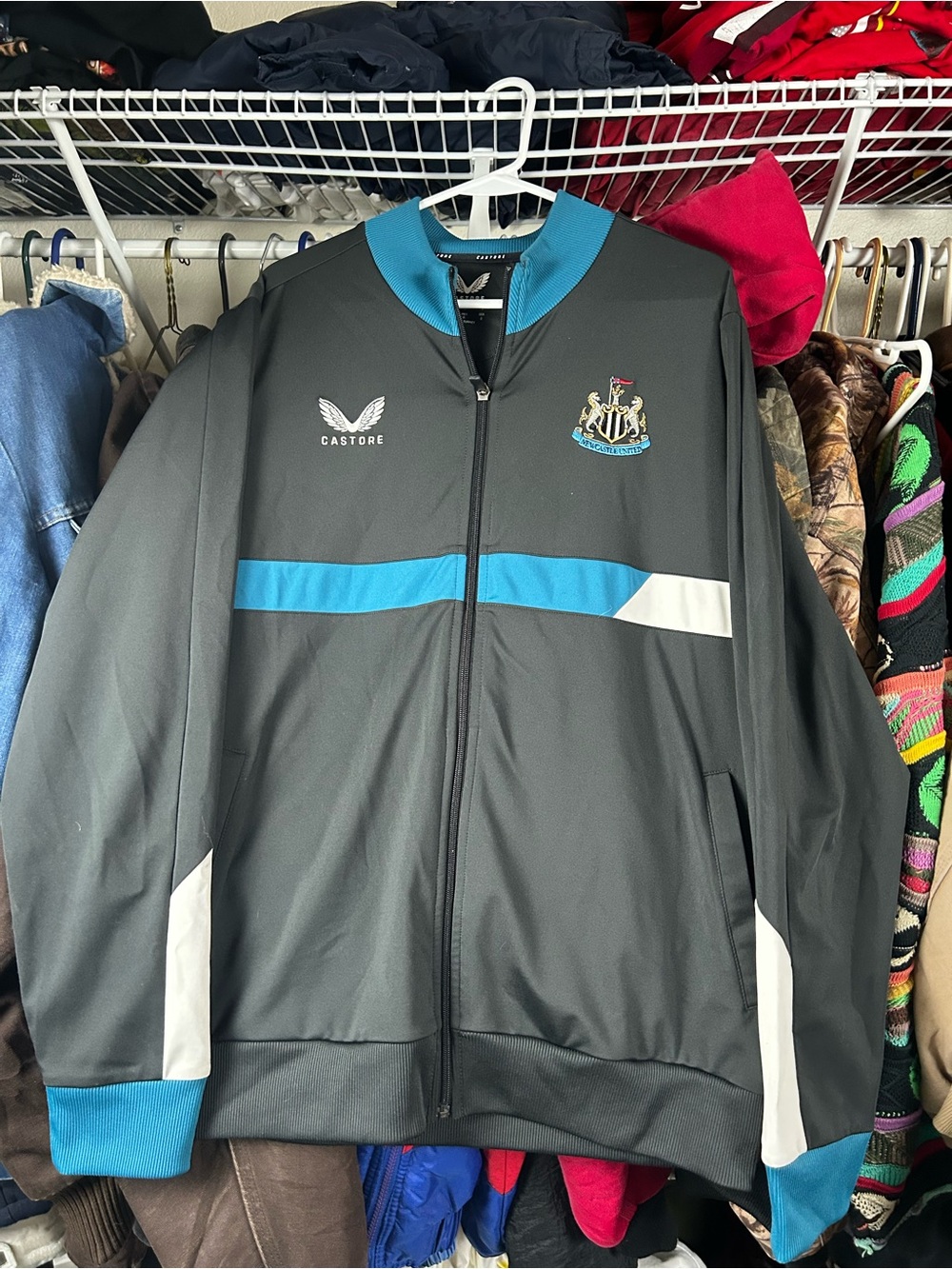 Castore Newcastle Mens Zip-Up Track Jacket in Black and Blue